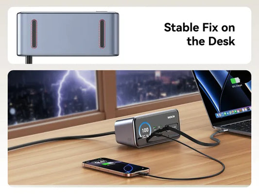 MOKIN charging station with non-slip pads for a stable desk fix. Lifestyle shot shows it powering a laptop and phone during a storm, emphasizing reliability and secure placement.