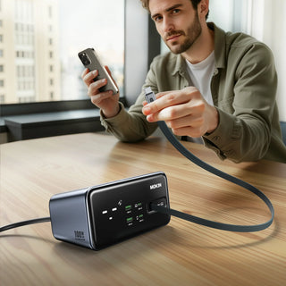 MOKiN MOGC1005 8-in-1 GaN family charging station, man plugging smartphone for fast charging at home desk